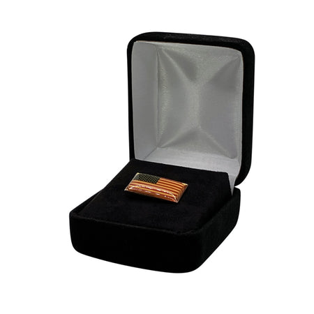 Luxury velour covered steel shell lapel pin box with hinged lid available in black, grey and navy blue featuring a custom hot stamped satin interior lid and white outer sleeve.